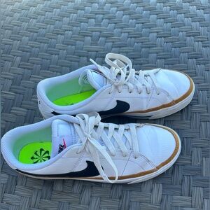 Women’s Nike White Low-Top Sneakers with Black Swoosh and Brown Accent size 8